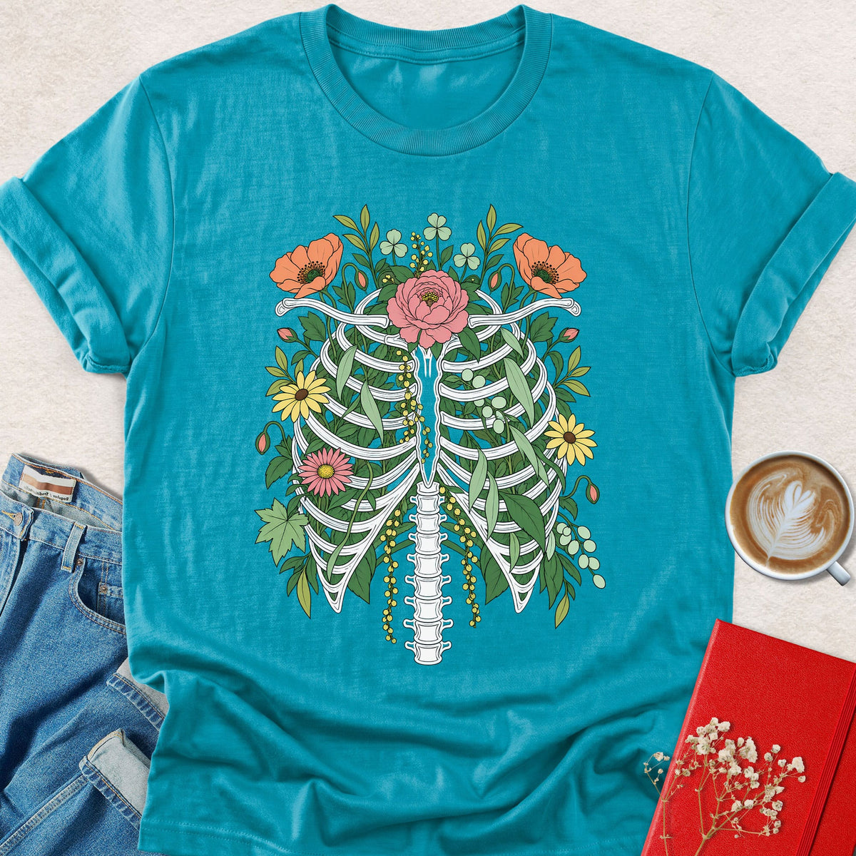 Floral ribcage graphic t-shirt in teal with colorful botanical floral spine print