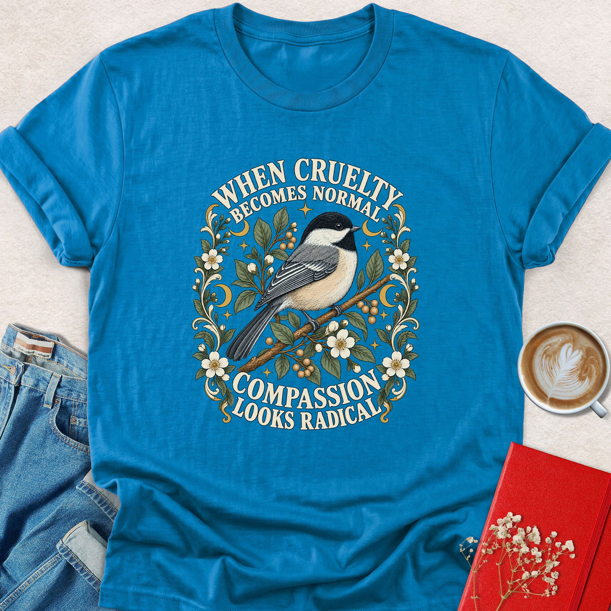 Sapphire blue bird graphic t-shirt with floral slogan print on front