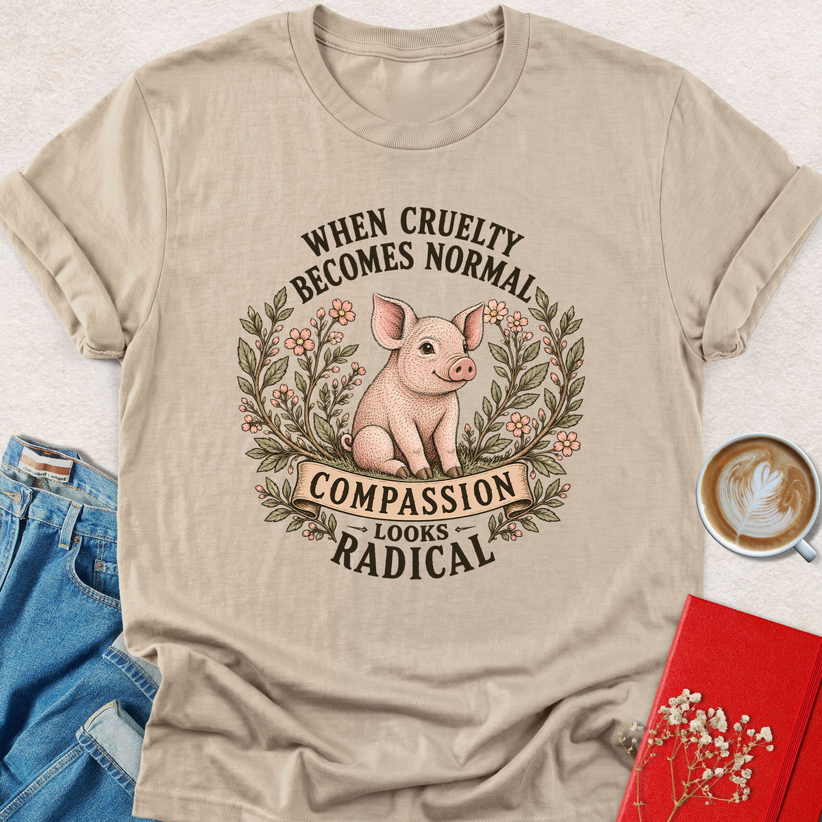 Sand pig graphic t-shirt with floral wreath and quote text, crew neck