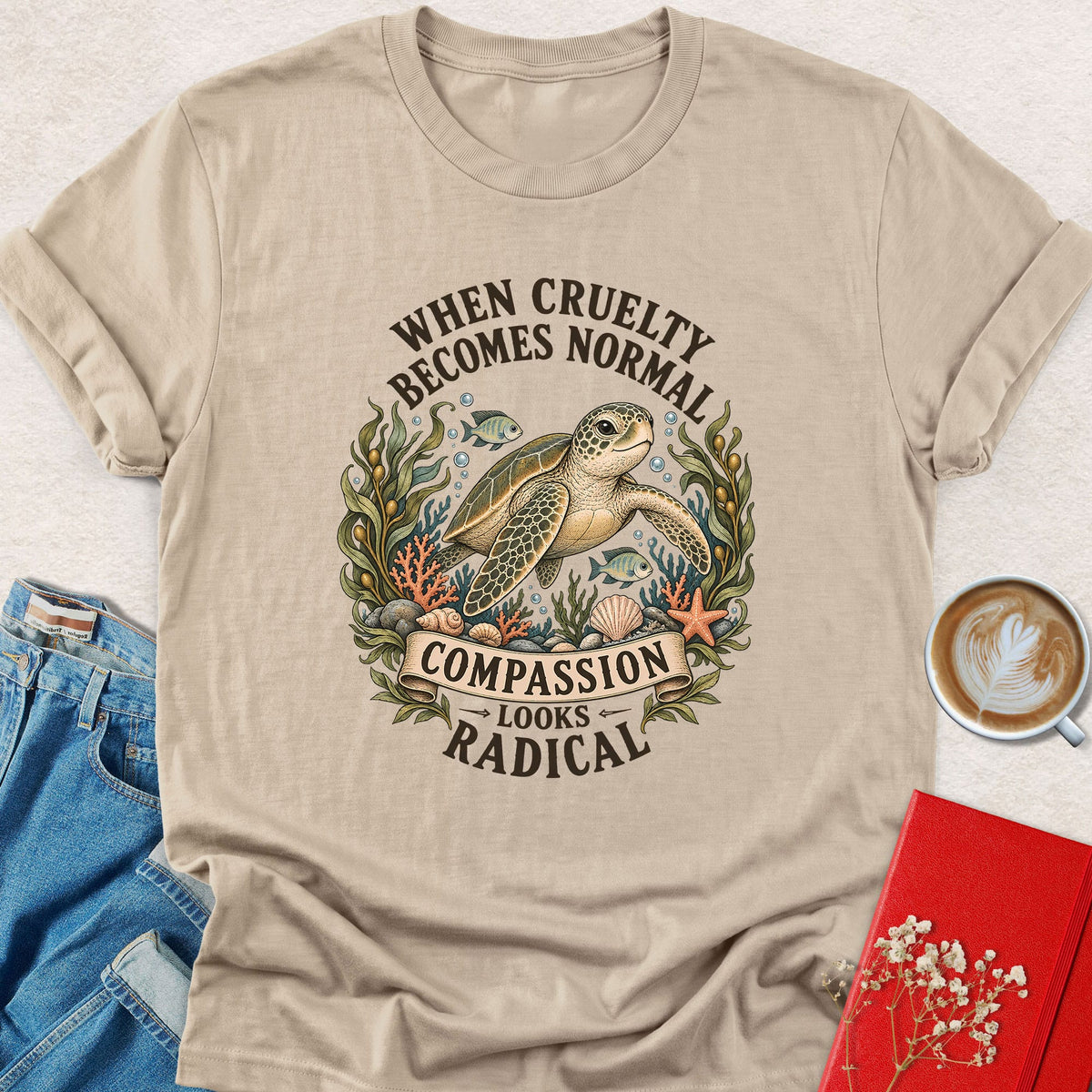 Sand crewneck sea turtle graphic T-shirt, 'Compassion looks radical' print