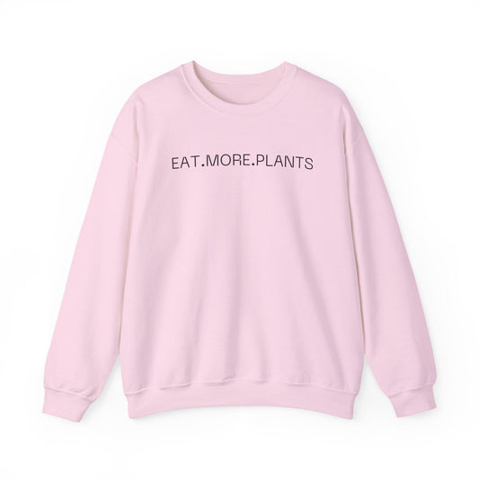 A light pink crewneck sweatshirt with the text 'EAT.MORE.