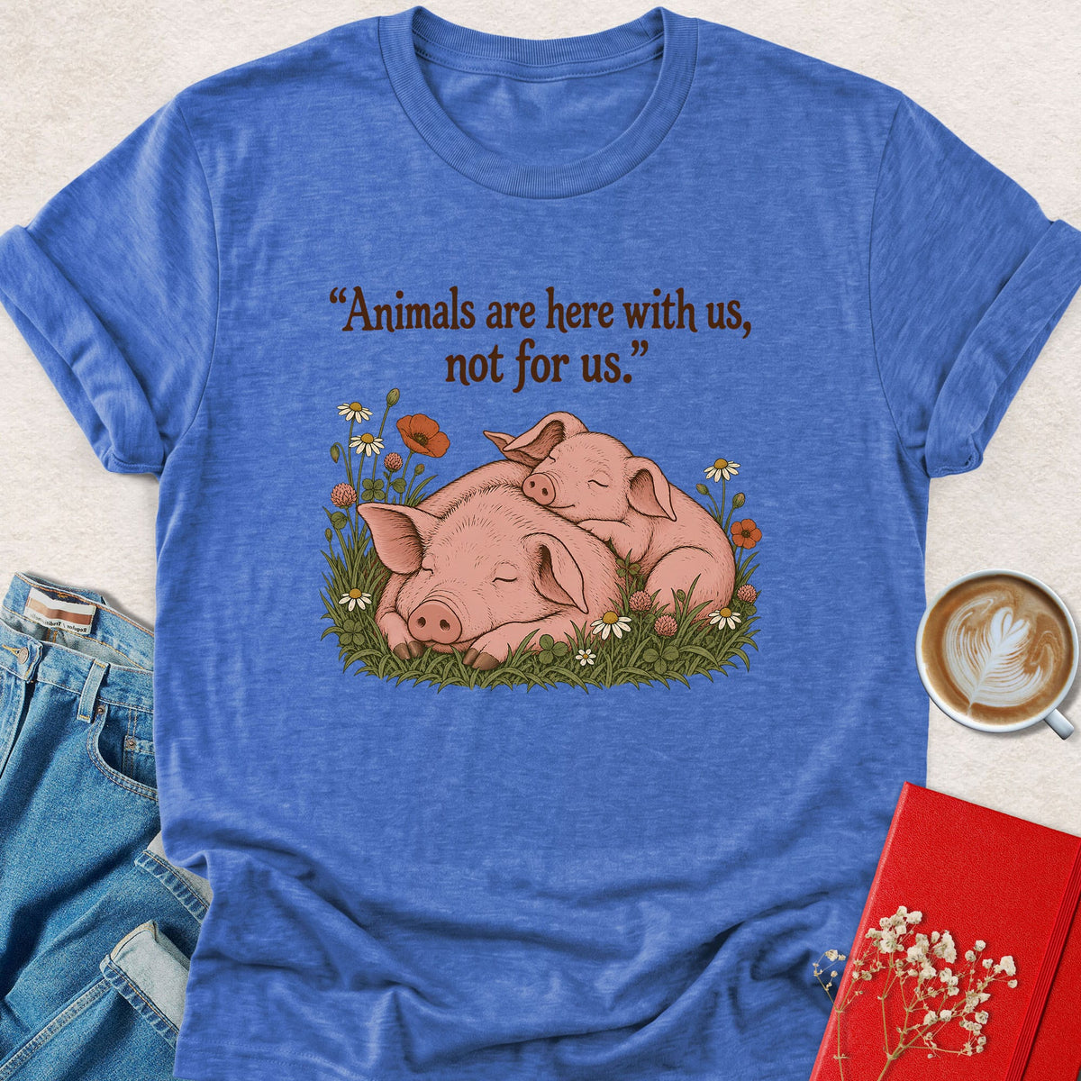 Royal blue T-shirt with sleeping pigs graphic on front