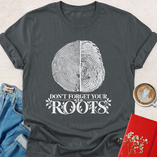 Charcoal gray crewneck T-shirt with tree-ring yin-yang graphic and 'DON'T FORGET YOUR ROOTS' print