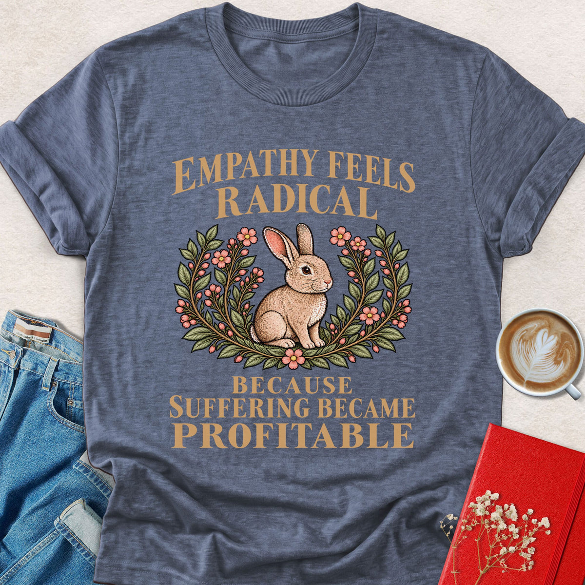 Slate blue graphic T-shirt with rabbit in floral wreath and slogan on front