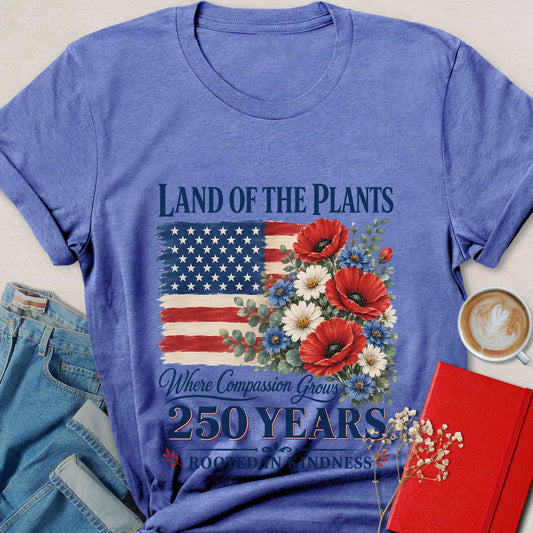 Land of the Plants vegan shirt with American flag, floral artwork, and compassion-themed patriotic design.
