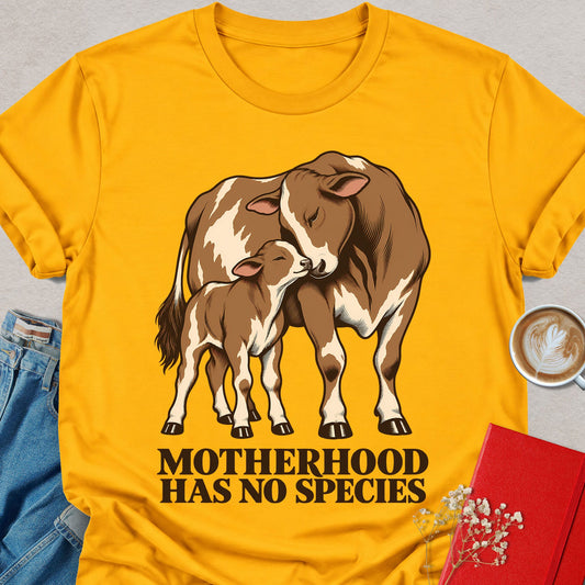 Gold T-shirt with cow mother and calf graphic and “MOTHERHOOD HAS NO SPECIES” text