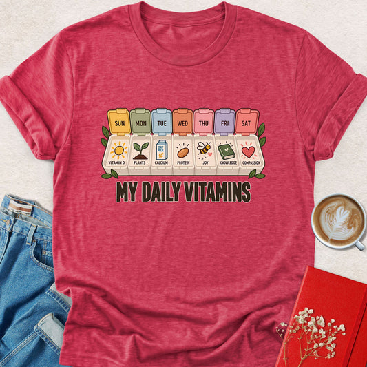 Heather red vegan t-shirt with 'My Daily Vitamins' weekly vitamin graphic on chest