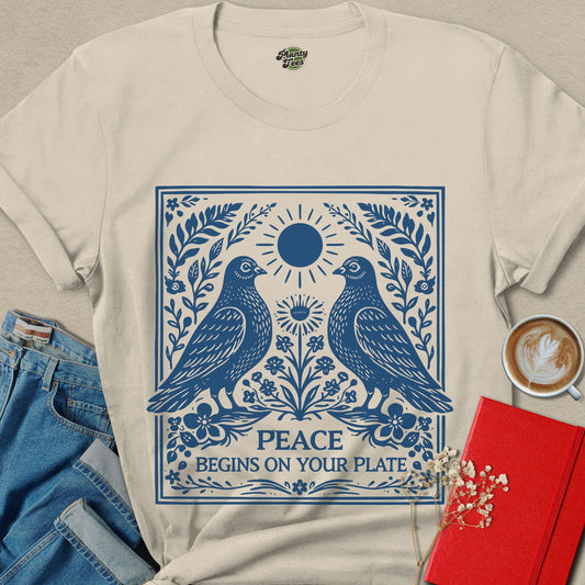 Natural vegan bird graphic tee with blue peace and plate text design