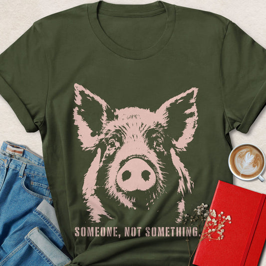 Military green pig face animal rights T-shirt with pink slogan text
