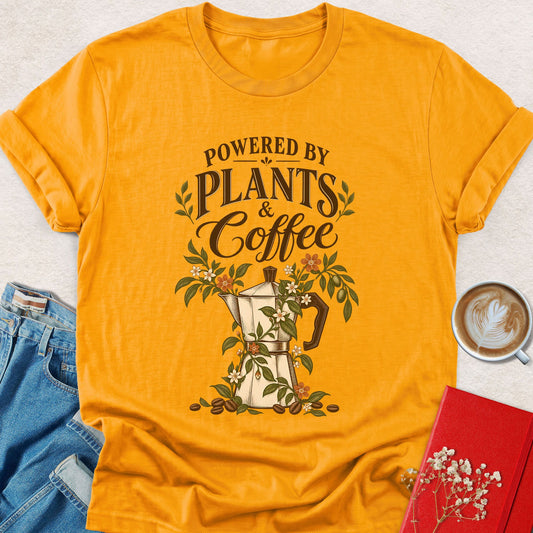 Orange floral graphic t-shirt with "Powered by Plants & Coffee" print