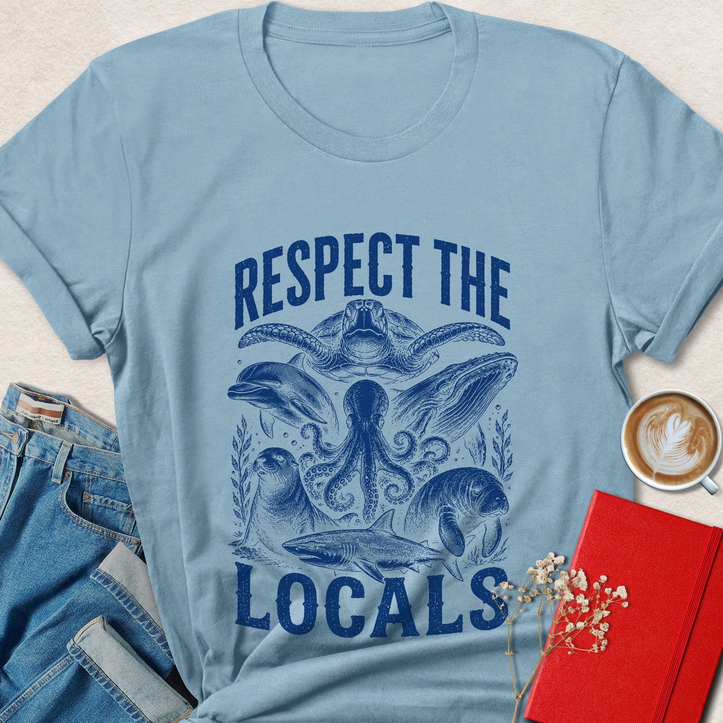 Respect the Locals vegan shirt featuring octopus, sea turtle, dolphin, whale, manatee, seal, and shark artwork.
