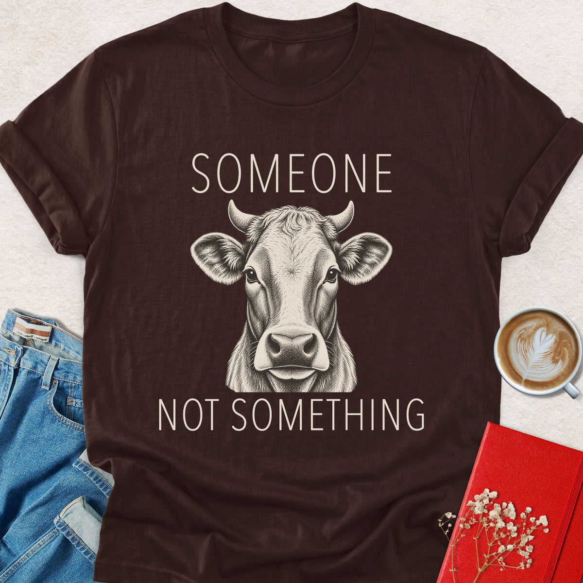 Brown cow graphic T-shirt with “Someone” and “Not something” text