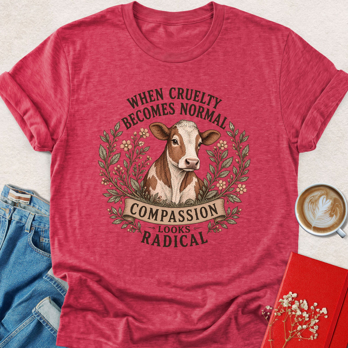 Heather red cow graphic T-shirt with Compassion Looks Radical slogan
