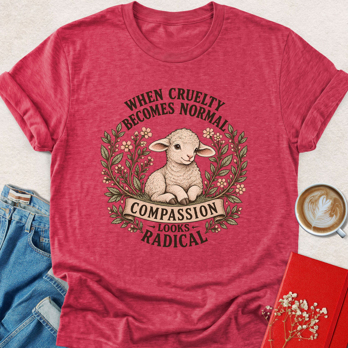 Red lamb compassion T-shirt with floral wreath and 'Looks Radical' slogan