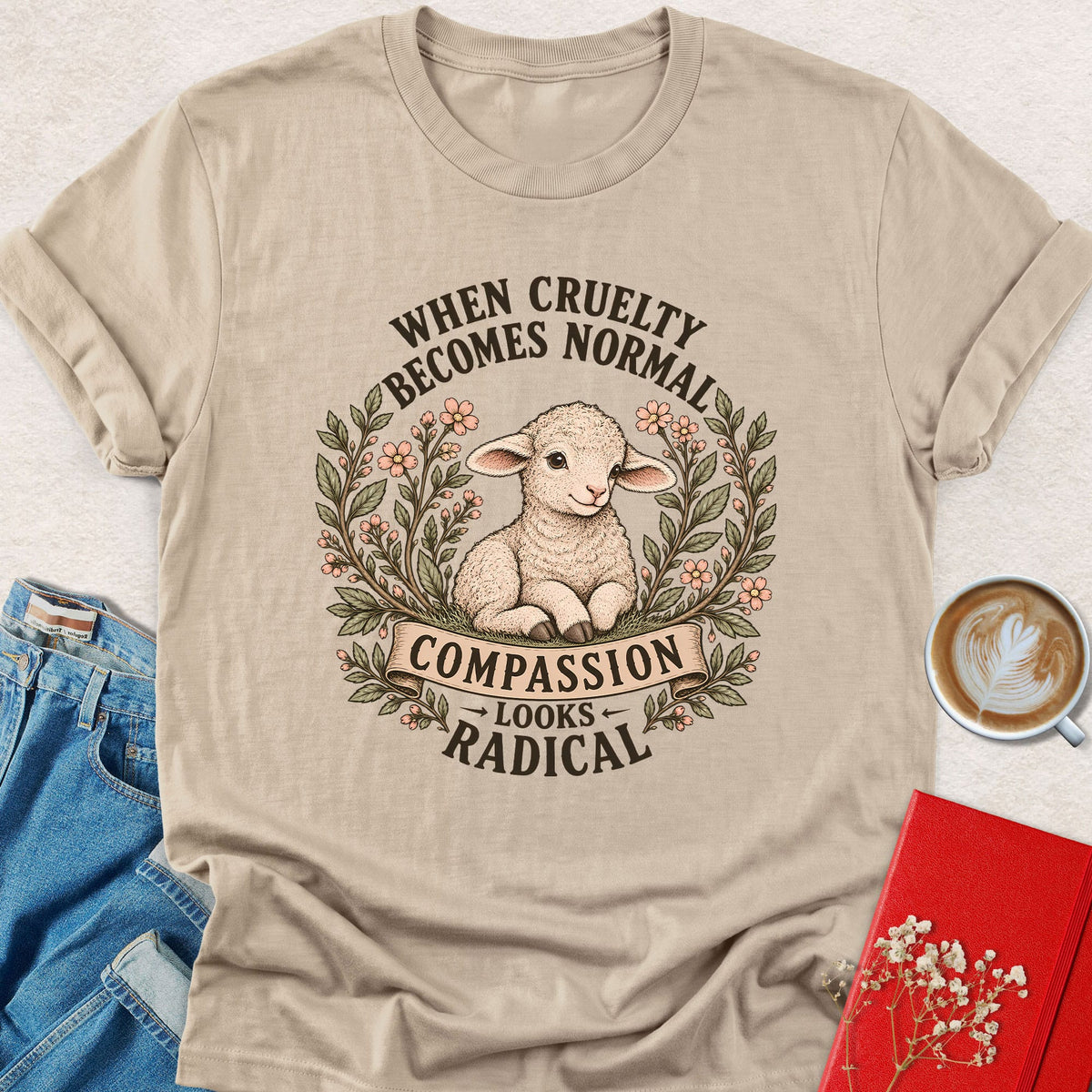 Sand lamb compassion T-shirt with floral wreath and 'Looks Radical' slogan