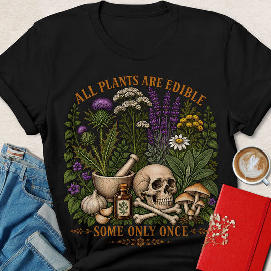 Black vegan tee with botanical skull and mushrooms graphic, 'All Plants Are Edible' text