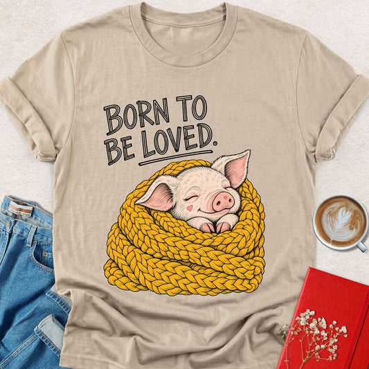 Sand piglet graphic T-shirt with 'Born to Be Loved' text and rope-wrapped design