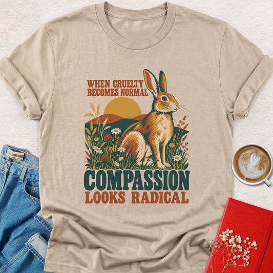 Sand T-shirt with rabbit graphic and 'COMPASSION LOOKS RADICAL' lettering