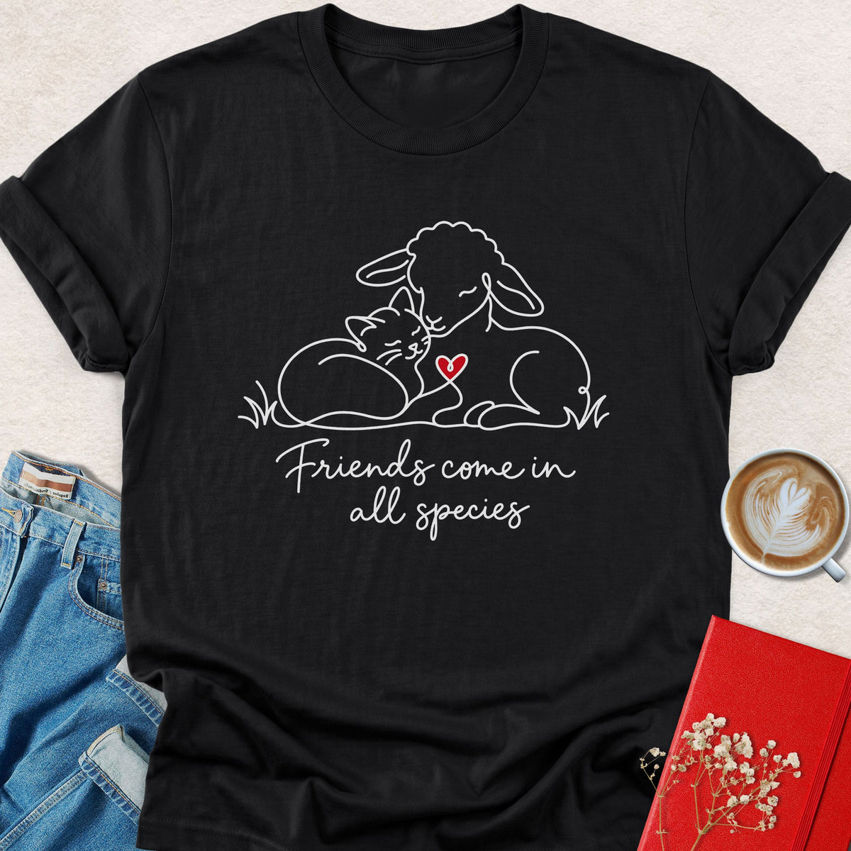 Black T-shirt with animal friends graphic and "Friends come in all species" text on front.