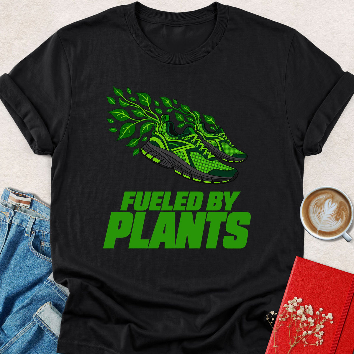 Black graphic T-shirt with green plant sneaker and 'Fueled by Plants' print