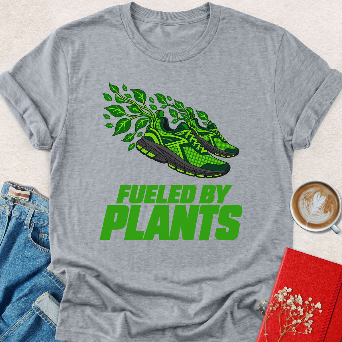 Light heather gray graphic T-shirt with green plant sneaker and 'Fueled by Plants' print