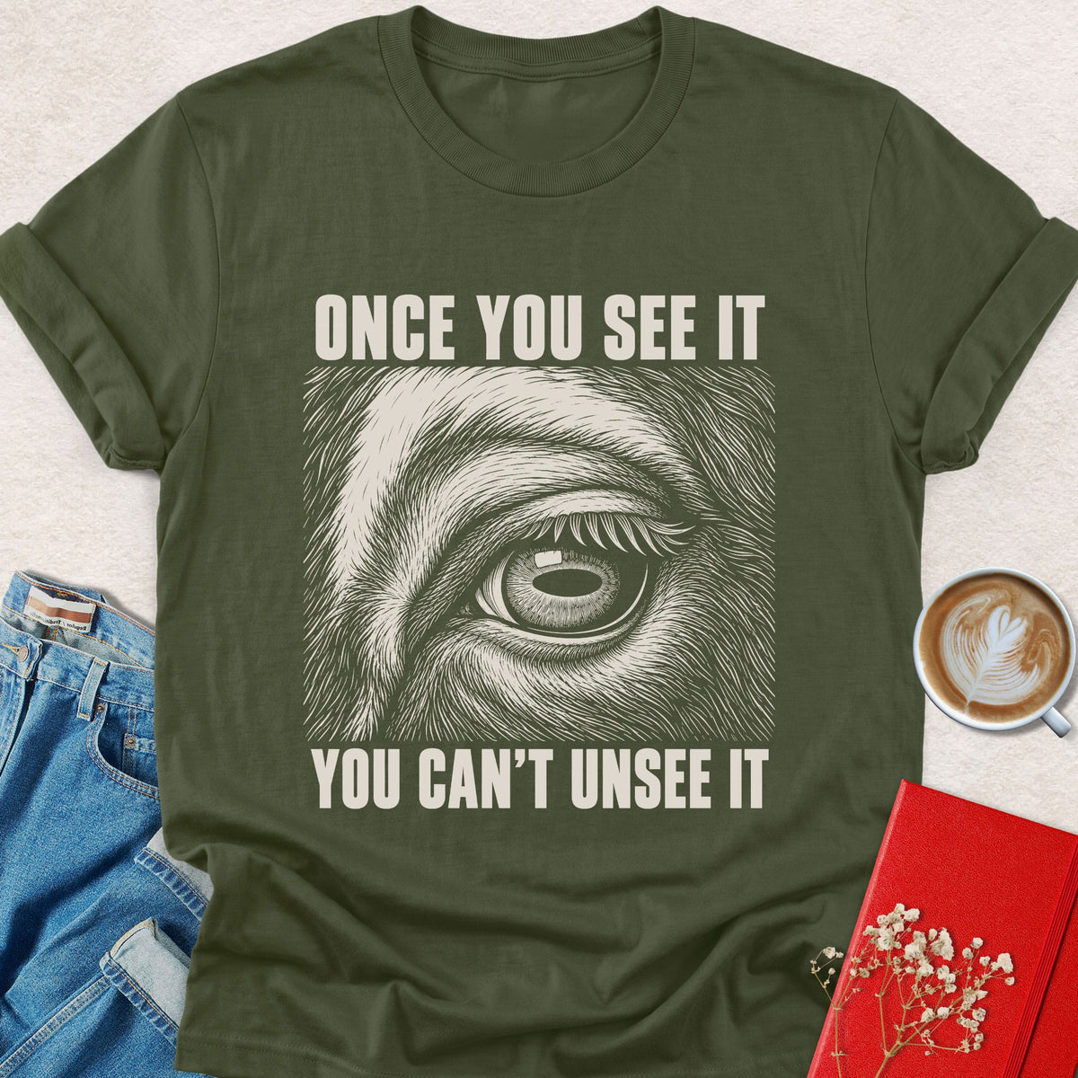 Military green crewneck T-shirt with animal eye graphic and 'Once You See It' text