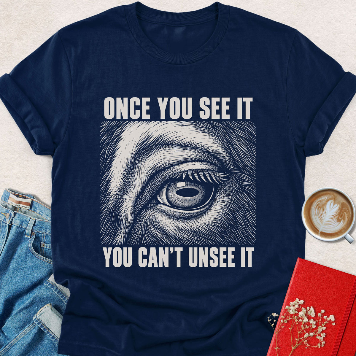 Navy crewneck T-shirt with animal eye graphic and 'Once You See It' text