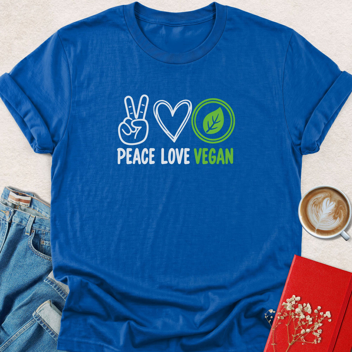 Royal blue peace sign graphic T-shirt with Peace Love Vegan lettering and leaf icons