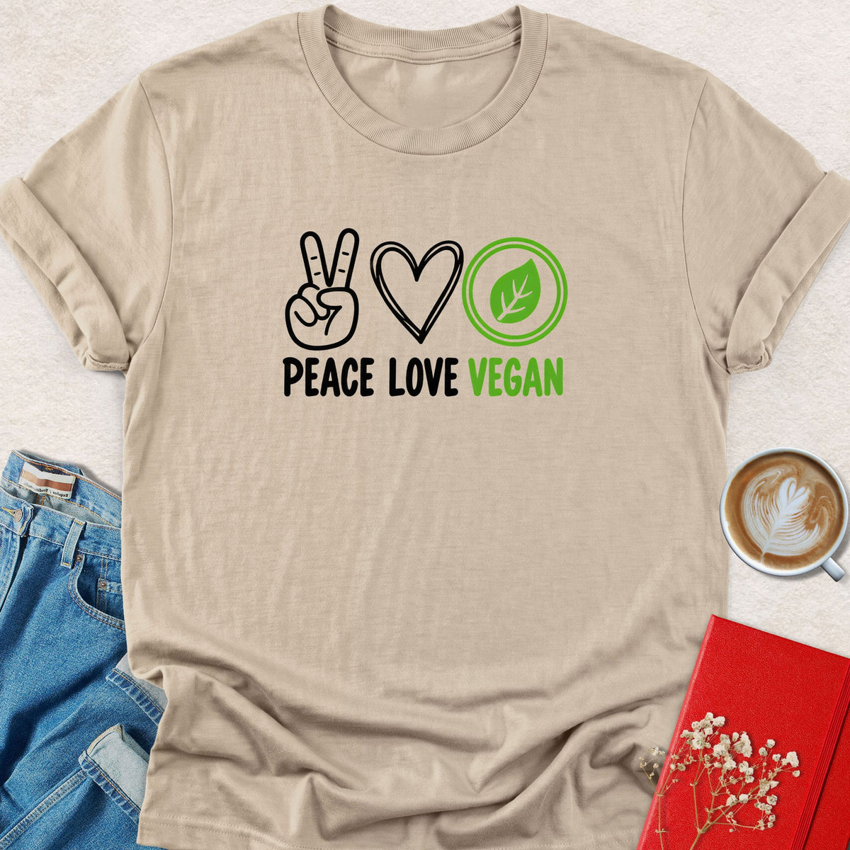 Beige peace sign graphic T-shirt with Peace Love Vegan lettering and leaf-heart icons