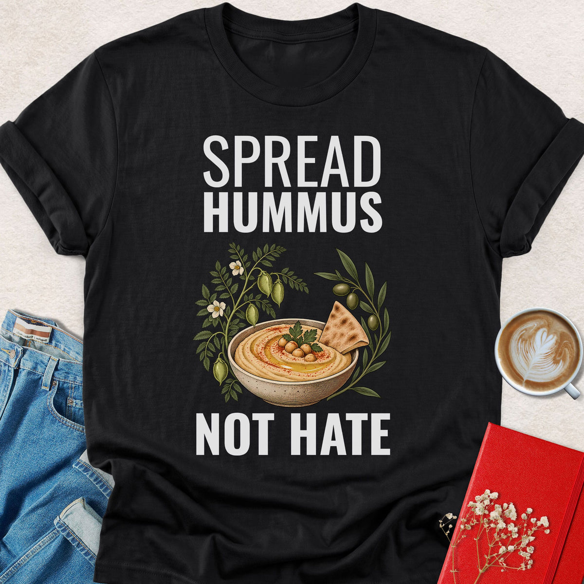 Black crewneck T-shirt with 'SPREAD HUMMUS'/'NOT HATE' slogan and hummus graphic.