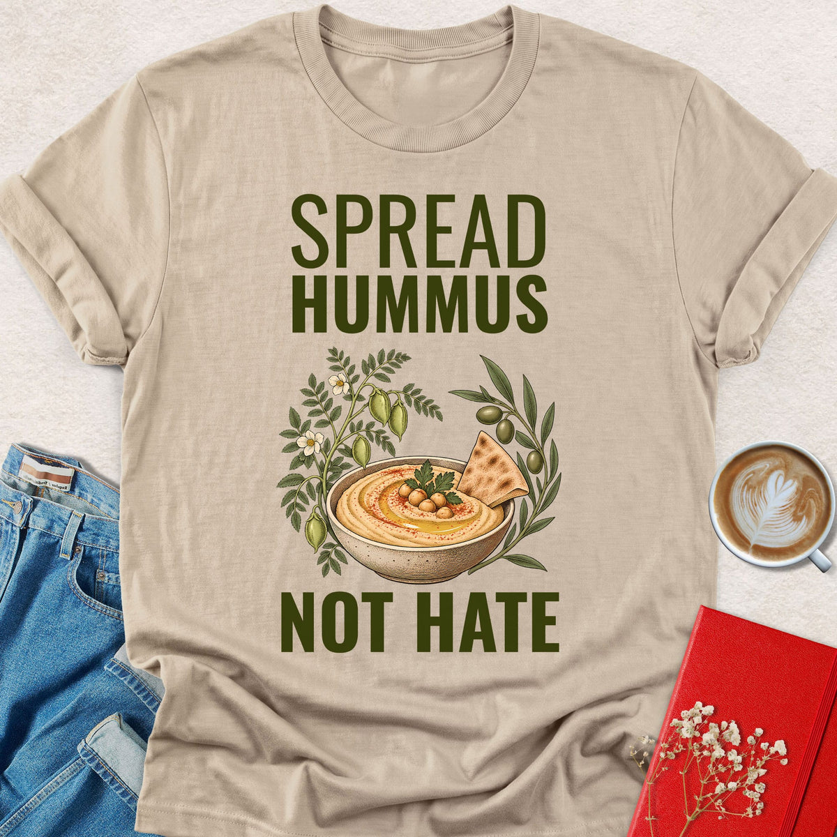 Sand beige crewneck T-shirt with 'SPREAD HUMMUS'/'NOT HATE' slogan and hummus graphic.