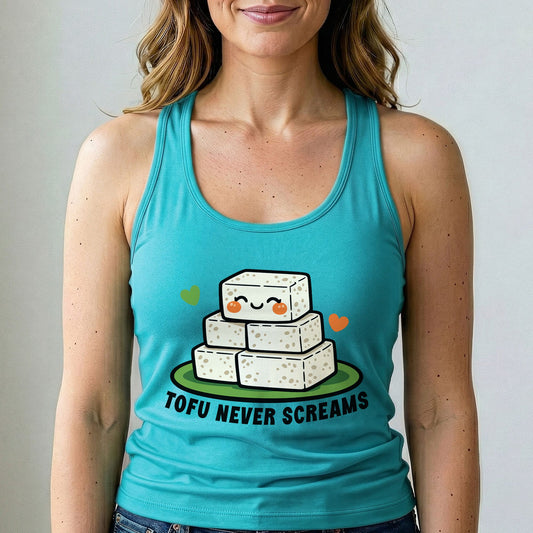 A woman wearing a turquoise racerback tank top with a cute graphic of stacked tofu blocks on a plate and the text 'TOFU NEVER SCREAMS'.