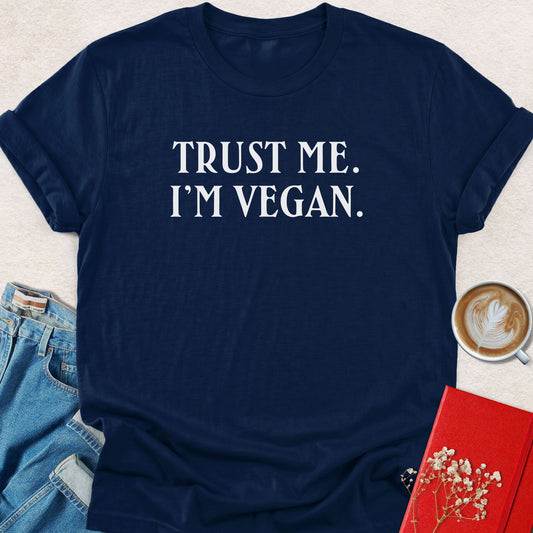 Navy graphic T-shirt with front text: “TRUST ME. I'M VEGAN.”