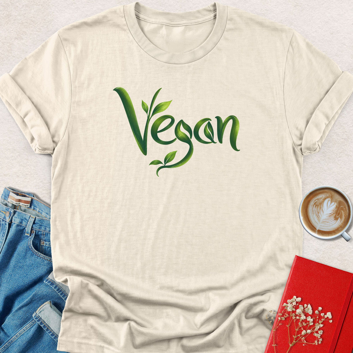 Natural off-white crewneck T-shirt with green vegan leaf script graphic
