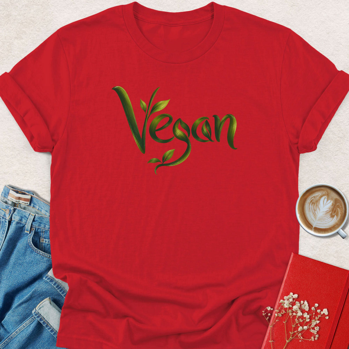 Red crewneck T-shirt with green vegan leaf script graphic