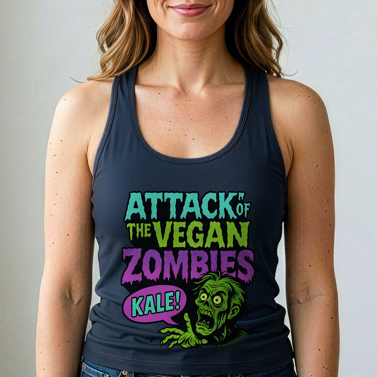 Person wearing a tank top with 'Attack of the Vegan Zombies Kale!' design.