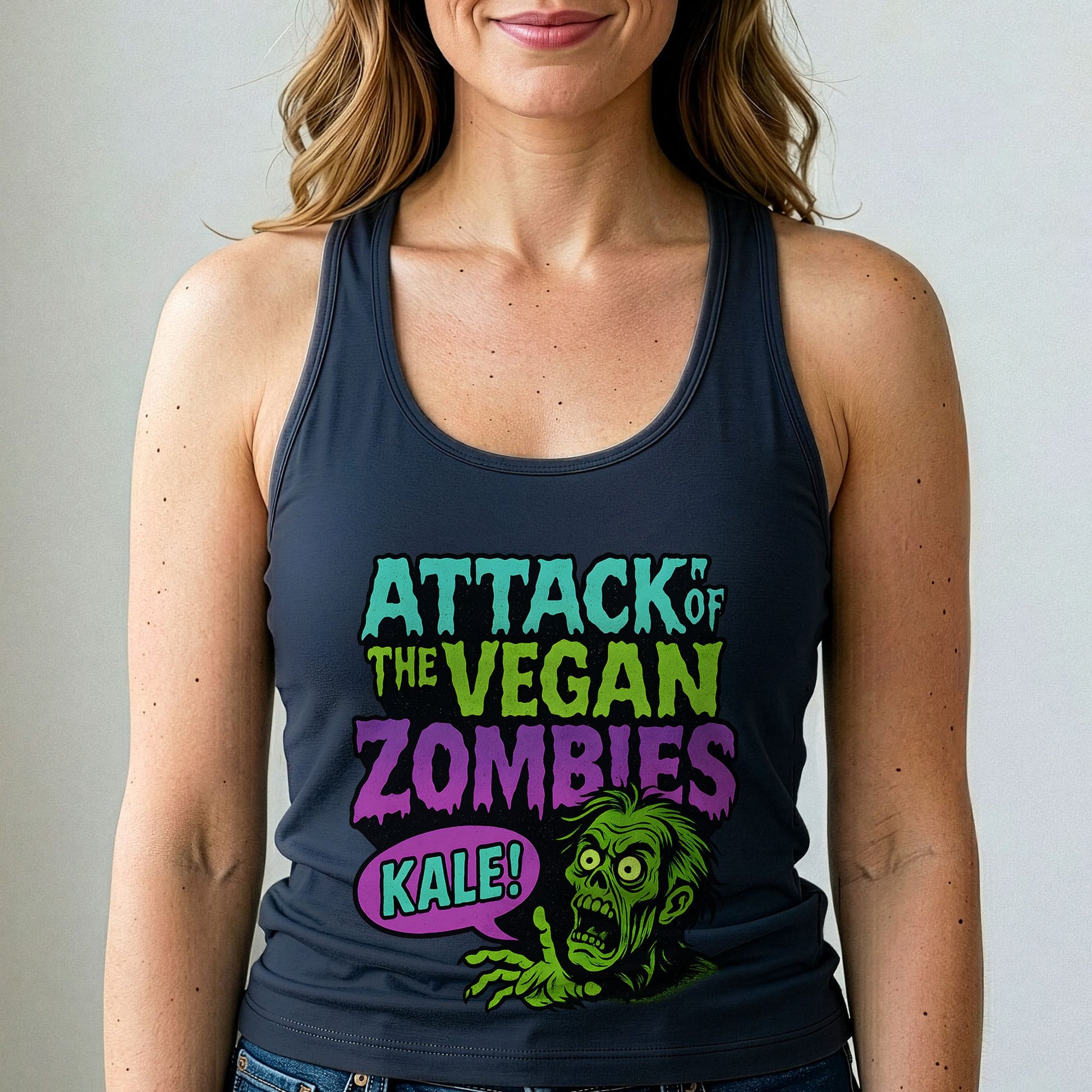 Person wearing a tank top with 'Attack of the Vegan Zombies Kale!' design.