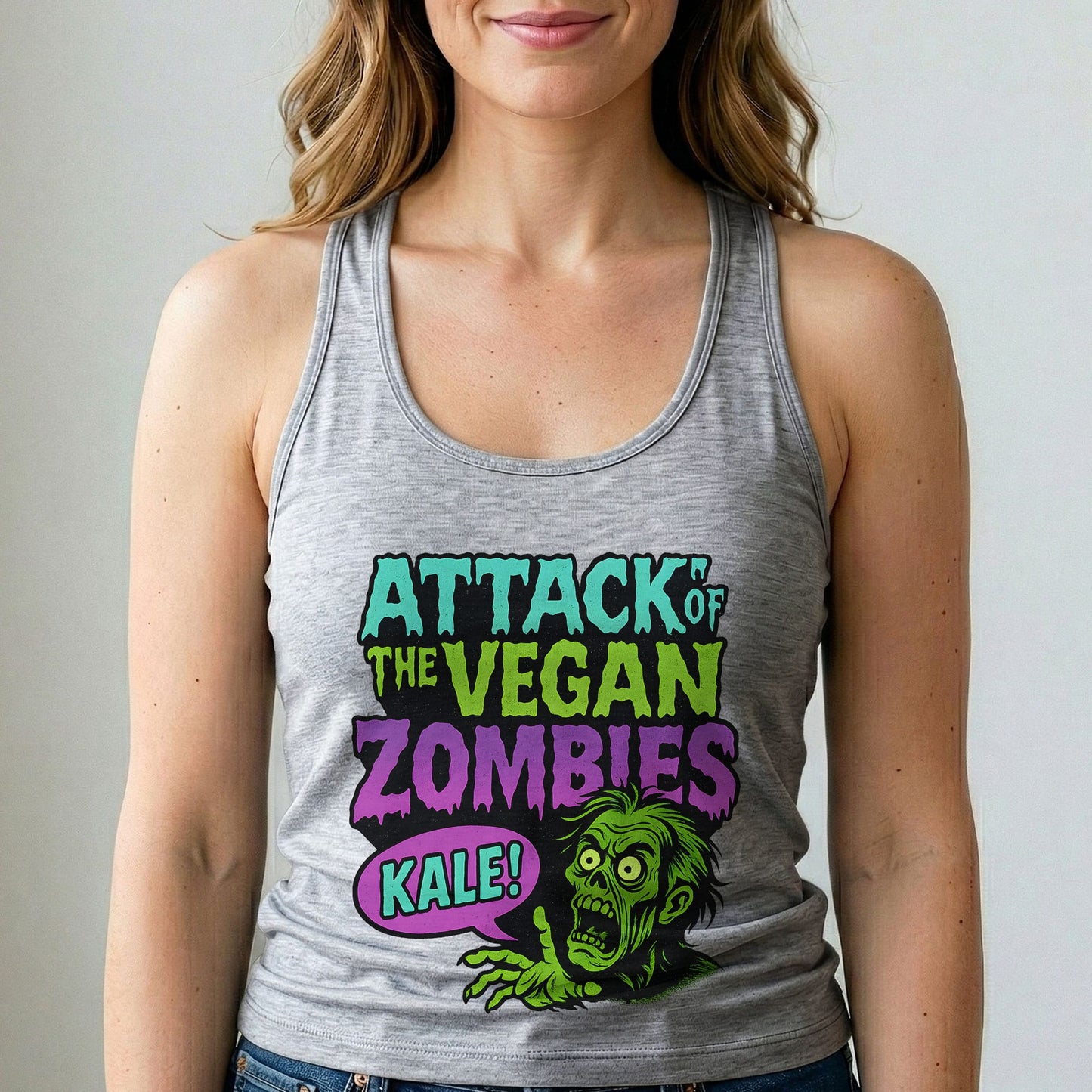 Person wearing a tank top with 'Attack of the Vegan Zombies Kale!' design.