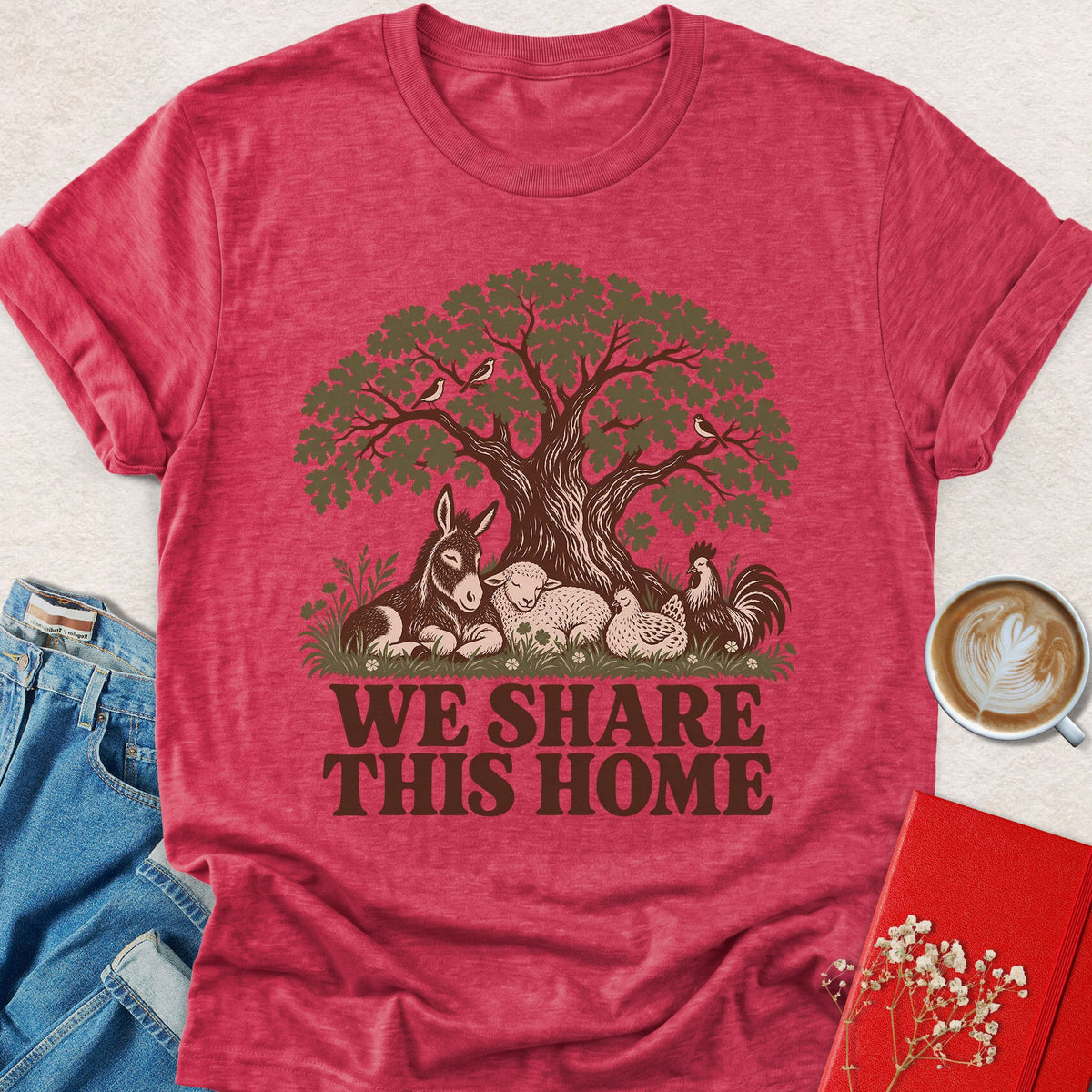 Red crewneck T-shirt with tree graphic and 'WE SHARE THIS HOME' text
