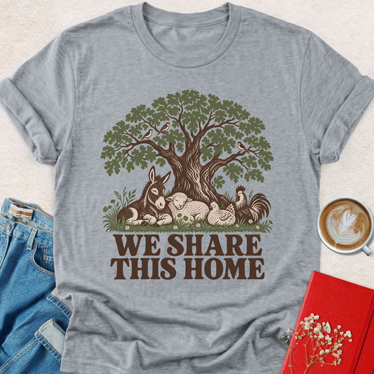 Heather gray crewneck T-shirt with tree-and-animals graphic and 'WE SHARE THIS HOME' text