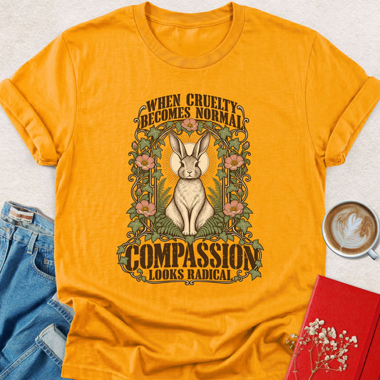 Gold t-shirt with rabbit sunburst graphic and floral text print